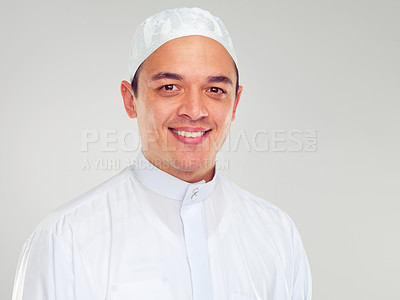 Buy stock photo Portrait, muslim and religion with an islamic man in studio on a gray background for faith, belief in god or devotion. Eid, worship and ramadan with a male arab fasting in holy tradition or culture