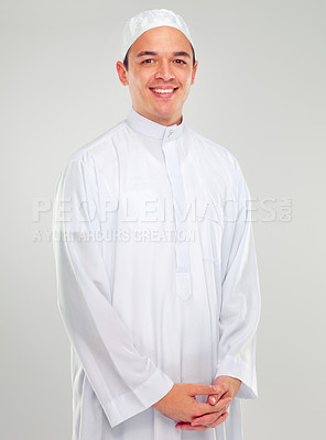 Buy stock photo Portrait, muslim and belief with an islamic man in studio on a gray background for religion, faith in god or devotion. Eid, worship and ramadan with a male arab fasting in holy tradition or culture