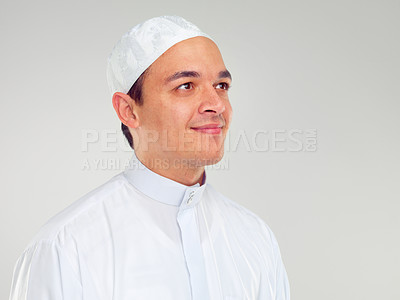 Buy stock photo Islam, culture and portrait of muslim man with smile on face in ramadan isolated on grey background. Youth, spiritual wellness and religion, happy Islamic scholar in white from Saudi Arabia in studio