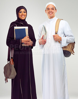 Buy stock photo Portrait, happy and Arabic students with books, learning and friends isolated on white studio background. Islamic, man and woman in traditional clothes, studying and education for knowledge or growth