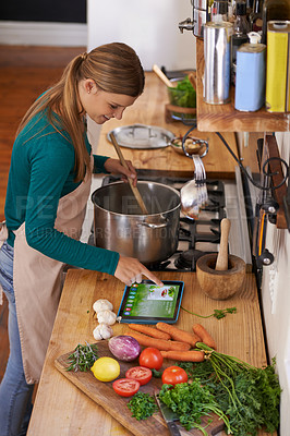 Buy stock photo Cooking, recipe and woman in kitchen with tablet for guide to learning how to meal prep a soup. Healthy, food and person reading online with a blog, article or search the internet or app for tutorial