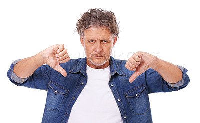 Buy stock photo Senior man, portrait and thumbs down, feedback or opinion with hand gesture for disagreement on white background. No, rejection and voting with anger, disappointment and negative review in studio
