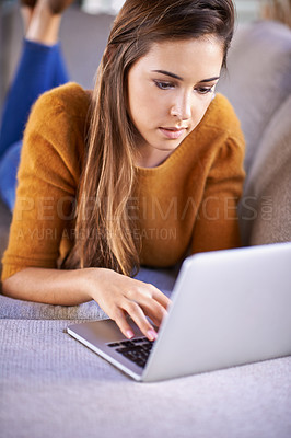 Buy stock photo Relax, home and woman with a laptop, typing and connection with internet in a living room. Person on couch, apartment and girl with a computer and research with website information, tech and network