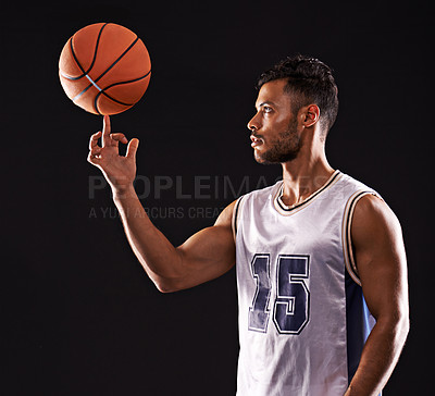 Buy stock photo Man, basketball playing and finger or sports game in studio or professional exercise, athlete or black background. Male person, training and fitness spinning or workout competition, uniform or mockup