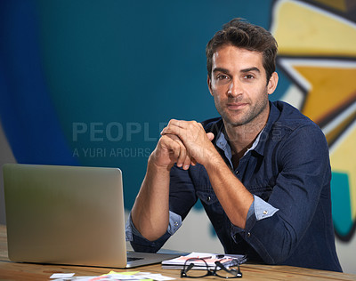 Buy stock photo A thoughtful young entrepreneur using his laptop