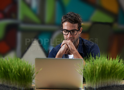 Buy stock photo Glasses, reading and man at laptop thinking for creative solution, online research and ideas in office. Brainstorming, computer and designer at desk with professional career, business plan and vision