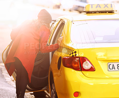 Buy stock photo Woman, cab and taxi for transport, commute and car for vehicle, passenger and move for traffic in urban. Young person and open door for lift, ride and drive in street or sidewalk with sun flare 