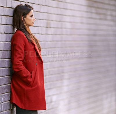 Buy stock photo Winter, jacket and woman on wall with fashion in city for travel with cool style in red coat. Streetwear, clothes and girl outdoor on building background with confidence and pride in New York spring