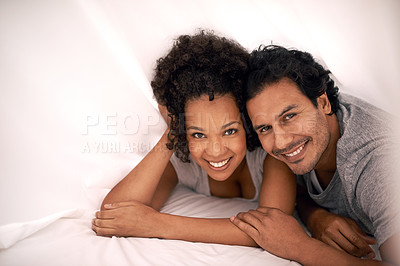 Buy stock photo Couple, portrait and bed with sheet for relax morning or calm for partnership cozy, bonding or apartment. Man, woman and happy under linen or honeymoon love for vacation getaway, carefree or peaceful