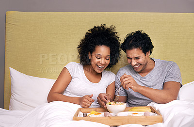 Buy stock photo Bed, breakfast and couple with smile for fruit, nutrition and healthy with food for eating in morning. Bedroom, man and woman with happiness for romance, wellness and girl with male person to relax