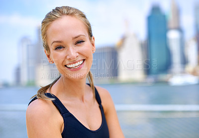 Buy stock photo Portrait, woman and smile at river side with city view on sport clothes to jog, fitness and healthy mindset in New York. Closeup, female person and happiness with self care in summer or hot weather