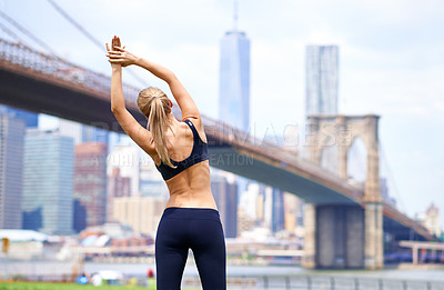 Buy stock photo Woman, stretching back for workout in city for fitness or exercise, physical health and stress relief. Girl active to warm up muscle, cardio and training for sports runner or athlete in New York.