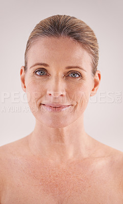 Buy stock photo Cropped portrait of a beautiful mature woman posing in studio