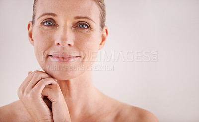 Buy stock photo Cropped portrait of a beautiful mature woman posing in studio