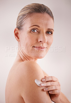 Buy stock photo Mature woman, cream and studio with treatment, portrait and cosmetic with skincare. Model, beauty and luxury with body, cosmetics and care for anti ageing and healthy skin for wellness and confidence