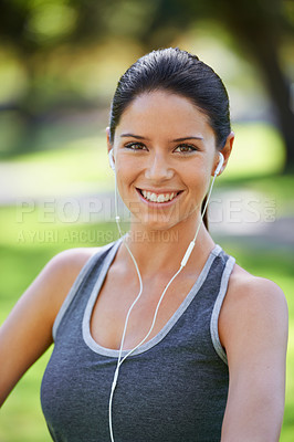 Buy stock photo Woman, portrait and listening to music in closeup in park, fitness and commitment to training for healthy body. Young lady, happy face and runner with streaming audio and morning workout in nature