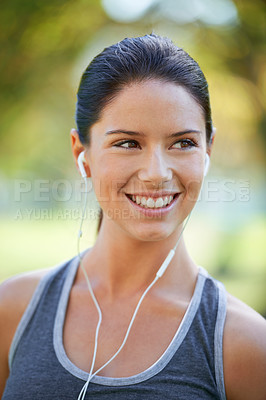 Buy stock photo Woman, earphones and music for exercise in park, closeup and audio inspiration for training in marathon race. Young lady, happy or streaming radio for fitness, commitment or morning workout in nature