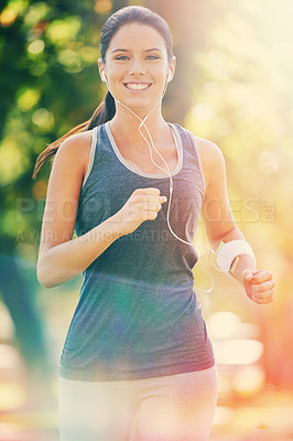 Buy stock photo Cropped shot of a young woman running in the park