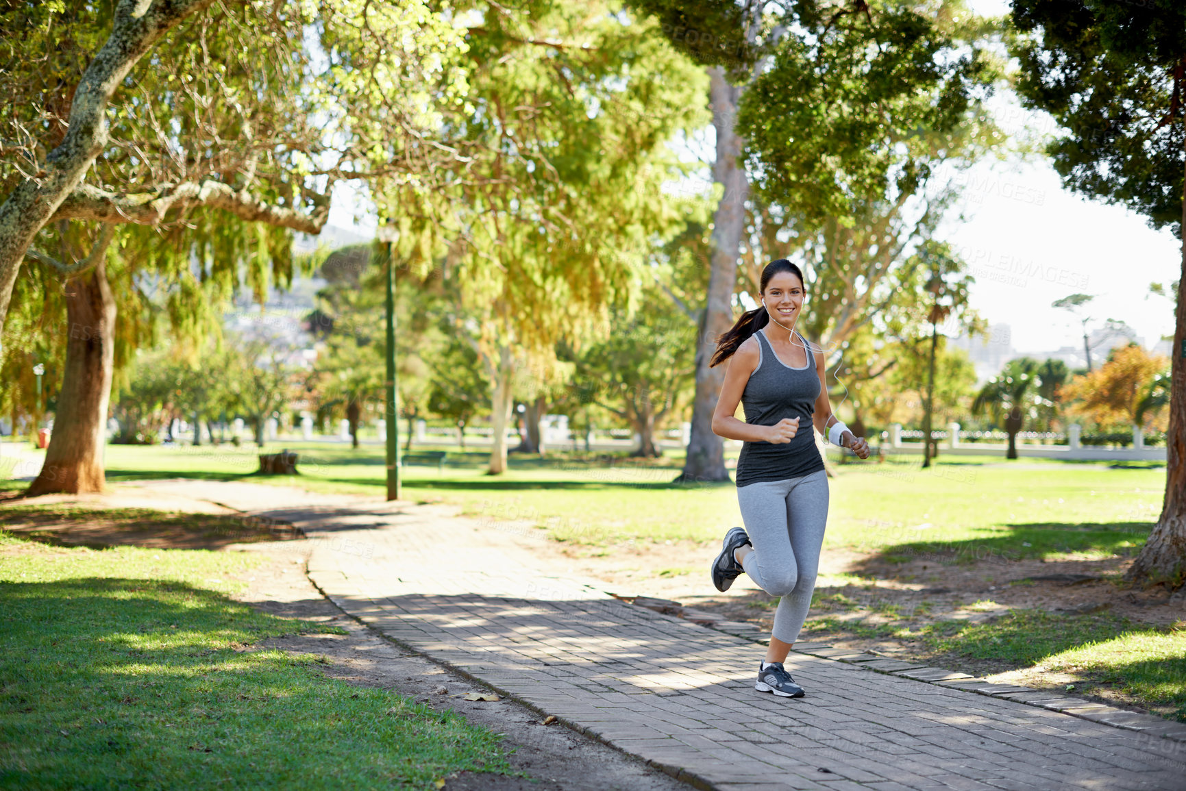 Buy stock photo Full length shot of an attractive young woman running in the park