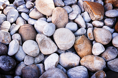 Buy stock photo Rock, pile and stone on ground closeup outdoor with detail on texture of environment and nature. Rocky, material and wallpaper of natural geology stack of pebbles in background with no people