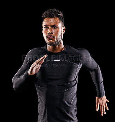 Buy stock photo Exercise, running and athlete man in studio for sprint workout, marathon or competition with black background. Sport, serious and male model person for speed, endurance training and wellness