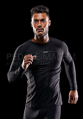 Buy stock photo Exercise, athlete and runner man in studio for sprint workout, marathon or competition with black background. Fitness, serious and male model person for speed, endurance training and wellness