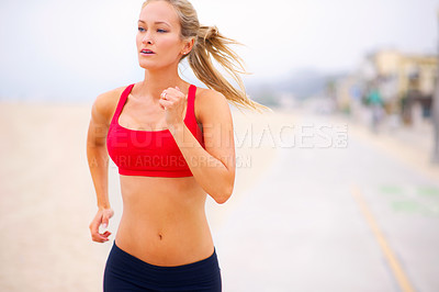 Buy stock photo Woman, runner and cardio by beach road, exercise and training for marathon in sportswear. Female person, outdoors and fitness for healthy body on street, jog and cardio challenge for active workout