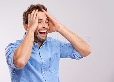 Buy stock photo Screaming, stress or sad man with hands on face in studio for mental health, crisis or mistake on white background. Anxiety, fear or male model with bad reaction to news, disaster or broken heart