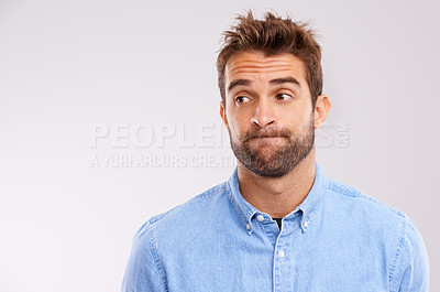 Buy stock photo A studio shot of a handsome man making a face
