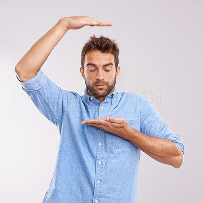 Buy stock photo Box, size and man with hand gesture in studio with thinking, imagination or dream of growth. Eyes closed, relax and male person with product placement, invisible package and scale on white background