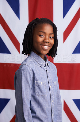 Buy stock photo Boy, portrait and happy with UK flag or backdrop for citizenship, government and human rights. Smile and face of black child, student or kid from united kingdom and Union Jack background for support