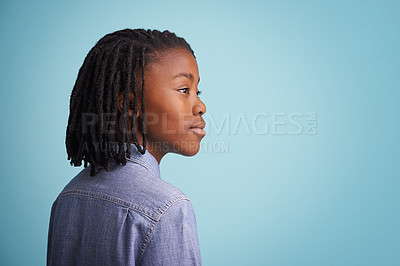 Buy stock photo Idea, thinking and black boy kid in studio with why, questions or memory on blue background. Planning, child development and African teen model with vision for solution, problem solving or reflection