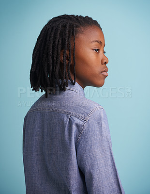 Buy stock photo Thinking, idea and black boy kid in studio with why, questions or memory on blue background. Planning, child development and African teen model with vision for solution, problem solving or reflection