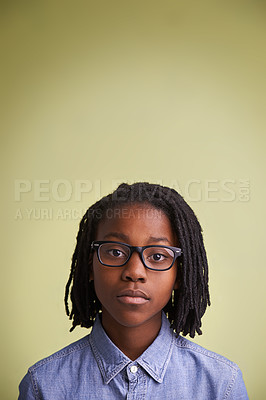 Buy stock photo African child, glasses and portrait in studio for education, learning and knowledge on a green background. Face of creative and smart kid, boy or student with vision for school in studio and mock up