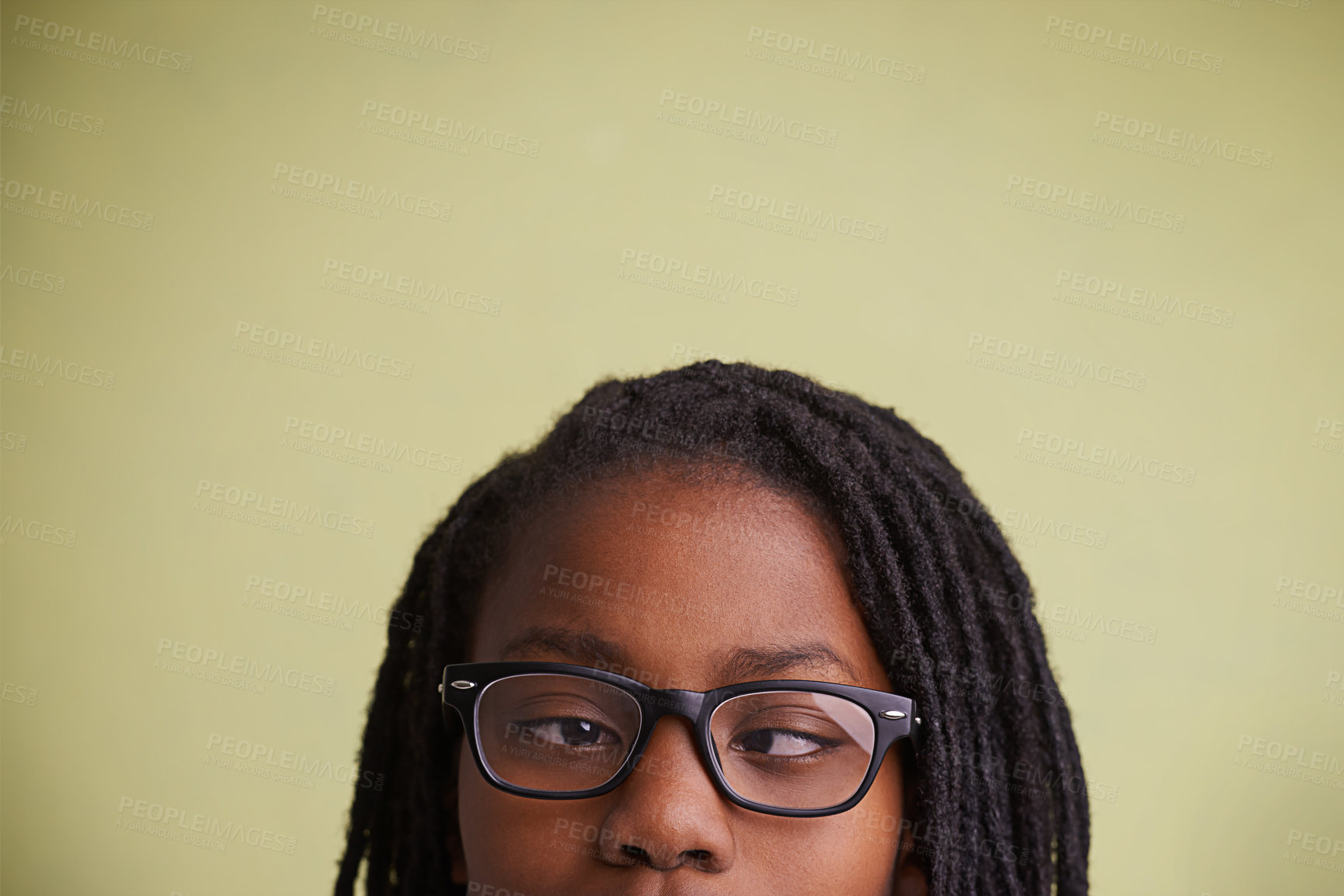 Buy stock photo Glasses, vision and boy kid with cross eyes in studio for eye care, testing or optometry on green background. Medical, help and black teen model with eyeball correcting lens, prescription or solution