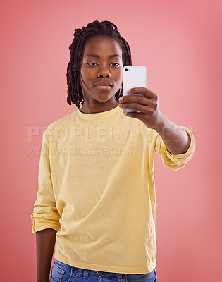 Buy stock photo Child, phone and fashion in studio for photo, capture and record for adolescent and kids. African boy or tween and smile with mobile for lens, playful and young for childhood, cool and growing up