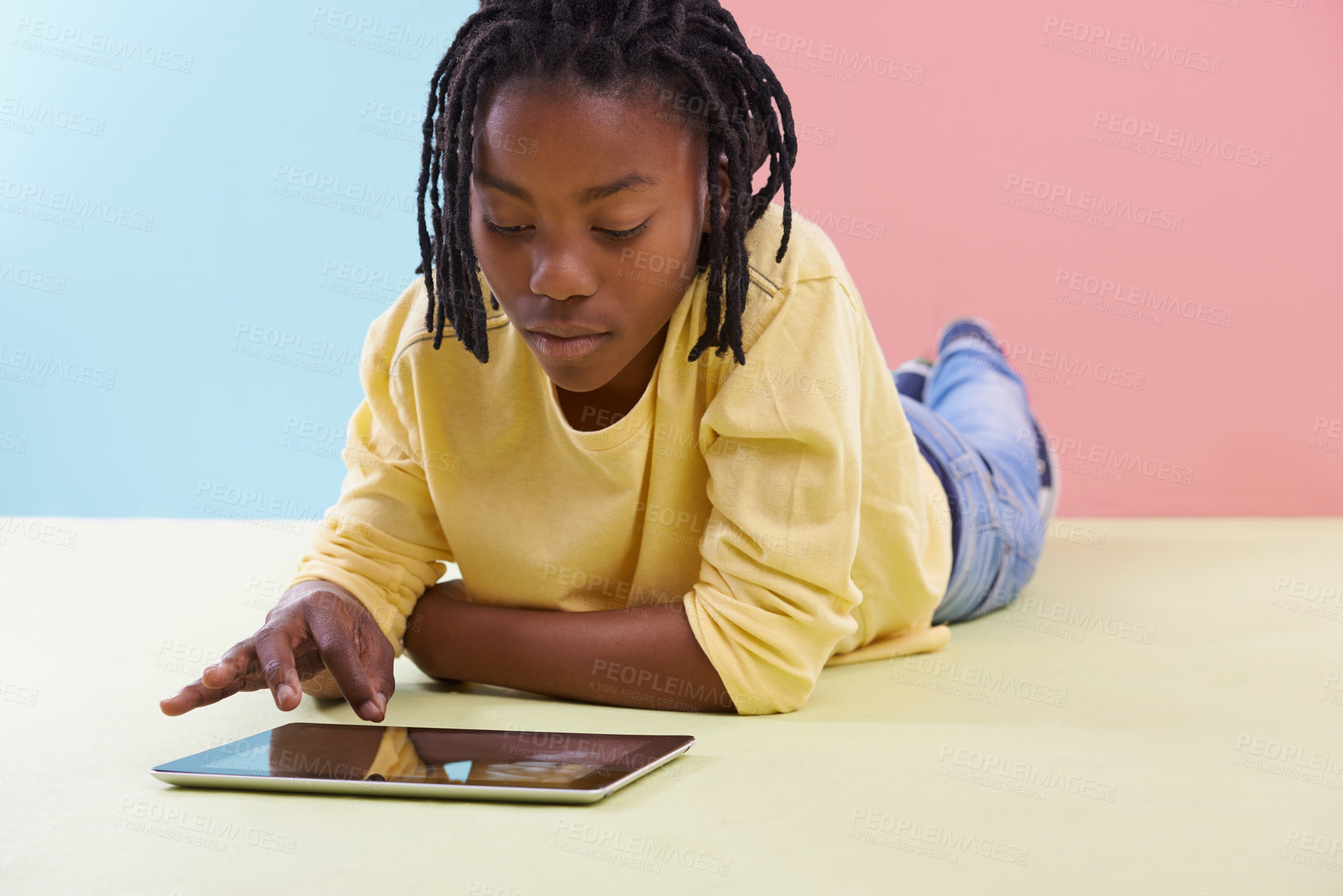 Buy stock photo Tablet, search and African boy child on floor with social media, ebook or cartoon at home. Digital, relax or teenage person with app for Netflix and chill sign up, google it or gaming subscription