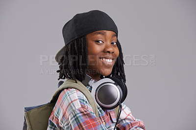 Buy stock photo Headphones, happy and portrait of child on gray background for listening to song, audio and radio. Fashion, youth and young African boy with music, track and playlist in trendy clothes in studio