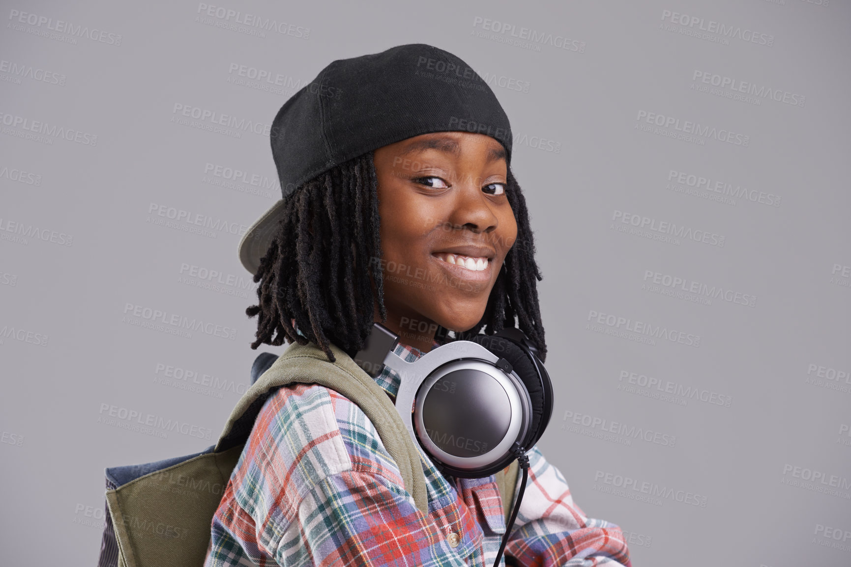 Buy stock photo Headphones, happy and portrait of child on gray background for listening to song, audio and radio. Fashion, youth and young African boy with music, track and playlist in trendy clothes in studio