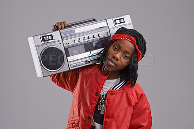 Buy stock photo Child, hip hop and portrait with radio for rap music and dance in a studio with urban clothing. Fashion, African kid and boombox with trendy clothes and youth swag with confidence and grey background