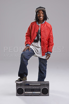 Buy stock photo Teen, hip hop and portrait with radio for music and dance in a studio with urban clothing. Fashion, African person and boombox with trendy clothes and youth swag with confidence and grey background