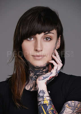 Buy stock photo Woman, portrait and stylist with tattoo for facial treatment, style or body art on a gray studio background. Face of female person, young model or smile for design, creativity or cool beauty artist