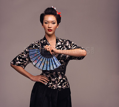 Buy stock photo Asian woman, clothes and hand fan with confidence in  studio on brown background in traditional style and elegant. Portrait, Japanese and female person with designer, fashion and outfit for heritage 
