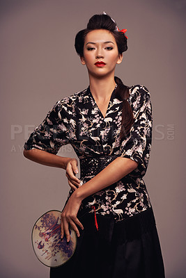 Buy stock photo Asian woman, traditional and fashion with hand mirror in  studio on brown background in confidence, style and elegant. Portrait, female person and designer clothes with outfit for heritage. 