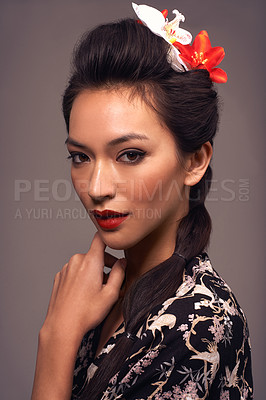 Buy stock photo Studio shot of an attractive young woman dressed in traditional asian clothing
