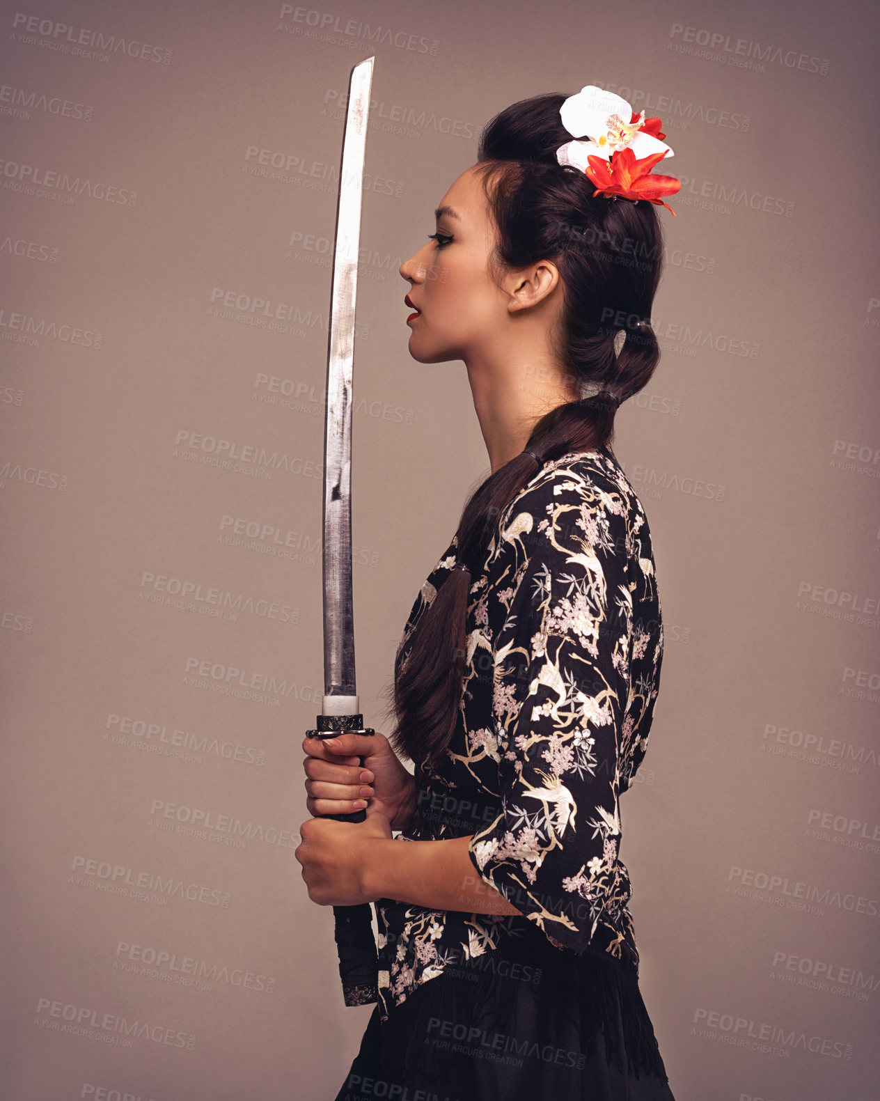 Buy stock photo Asian woman, fashion and confident with sword in studio on brown background in traditional style and elegant. Japanese, female person and cultural with designer clothes or outfit for heritage