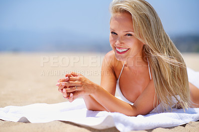 Buy stock photo Happy, beach and woman sunbathing in bikini on tropical vacation, adventure or holiday for travel. Smile, relax and portrait of person in swimwear on towel by sea for summer weekend trip in Australia