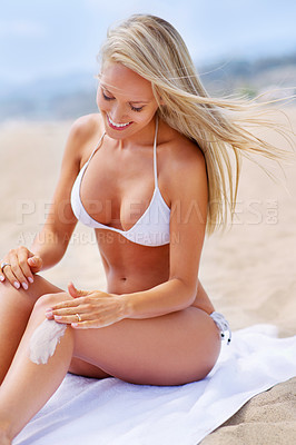 Buy stock photo A tanned woman relaxing on the beach in a bikini