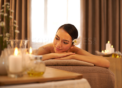 Buy stock photo Woman, smile and relax with candle at spa for aromatherapy, stress and relief and holistic massage. Asian person, peace and zen at luxury hotel for self care, body health and spiritual healing