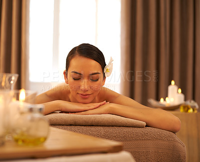 Buy stock photo Woman, candle and relax with peace at spa for aromatherapy, stress and relief and holistic massage. Female person, smile and zen at luxury resort for body health, self care and spiritual healing